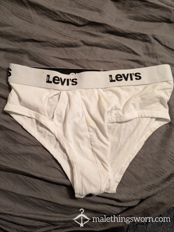 All White Levi's With Tear