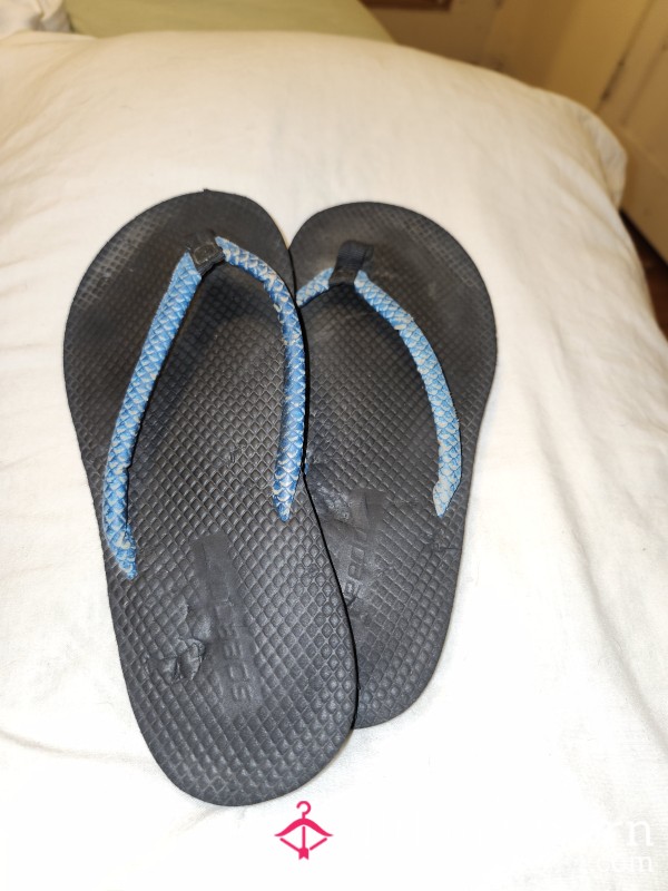 Worn Black Flip Flops